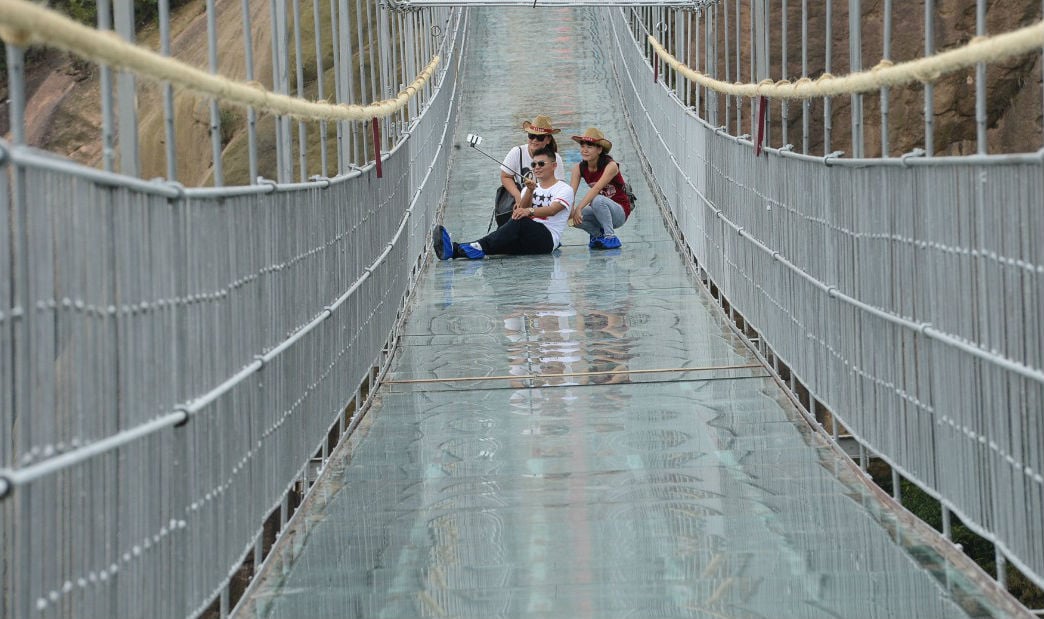 13 Pics Of A Glass Bridge That Strikes Fear In Tourists' Hearts 10